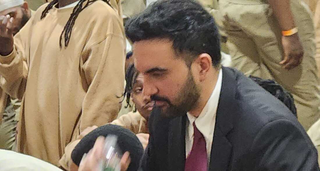 Mayor Zohran Mamdani surrounded by men incarcerated at the Rikers Island jail facility, where he prayed and shared an iftar meal.