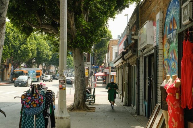 A man walks along Cesar E Chavez Avenue