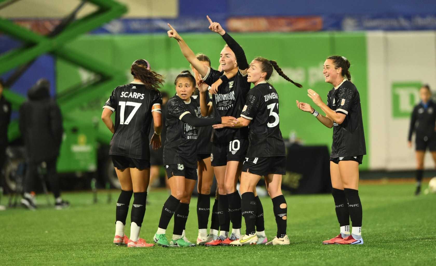 Brooklyn FC women players celebrate together during a match at Maimonides Park