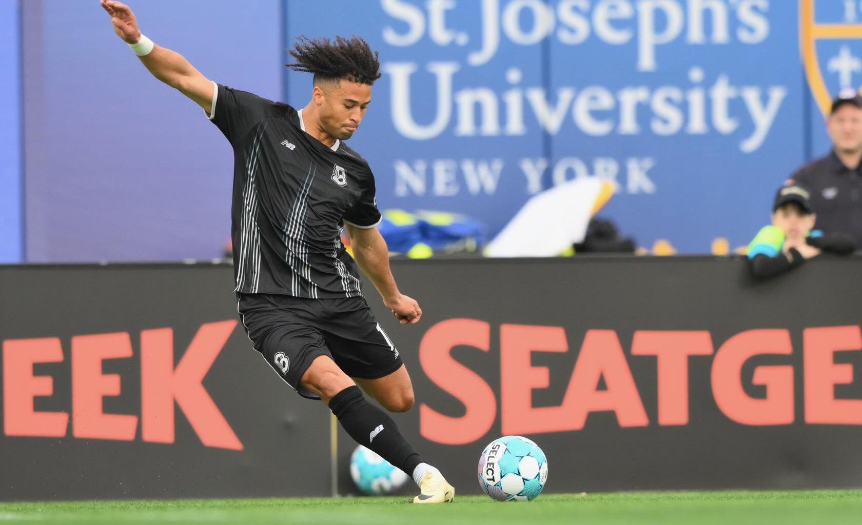 Jaden Servania of Brooklyn FC strikes the ball during a match at Maimonides Park.