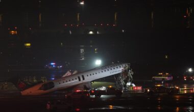Emergency personnel respond to an Air Canada Express CRJ-900 that is sitting on the runway after colliding with a Port Authority fire truck at LaGuardia Airport in New York, March 23, 2026. (AFP Photo)