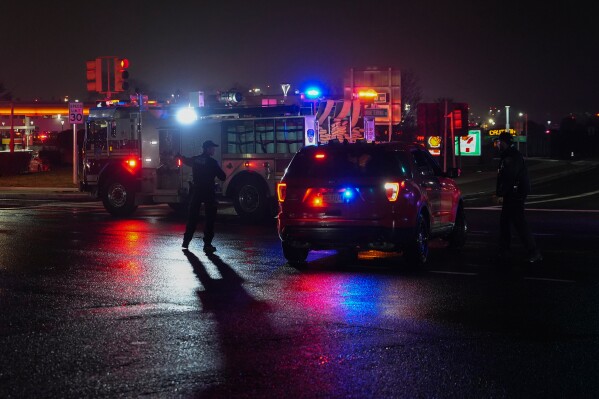 Firetrucks lineup outside LaGuardia Airport, Monday, March 23, 2026, in New York, after an Air Canada Jet collided with a Port Authority vehicle on a runway. (AP Photo/Ryan Murphy)