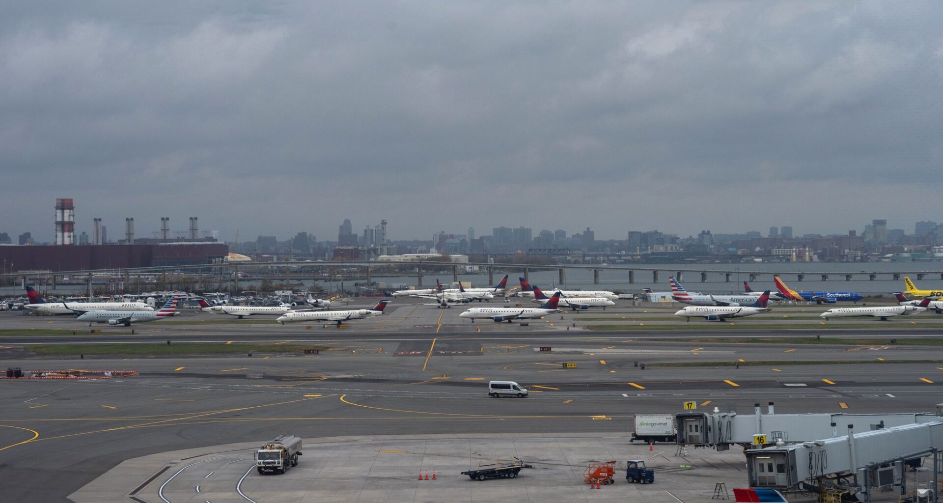 Pilot and copilot killed in collision between jet and fire truck at New York's LaGuardia Airport