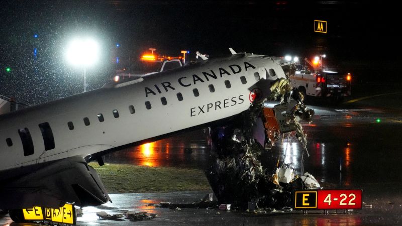 2 killed, dozens injured after Air Canada flight hits fire truck on runway at LaGuardia Airport, official says