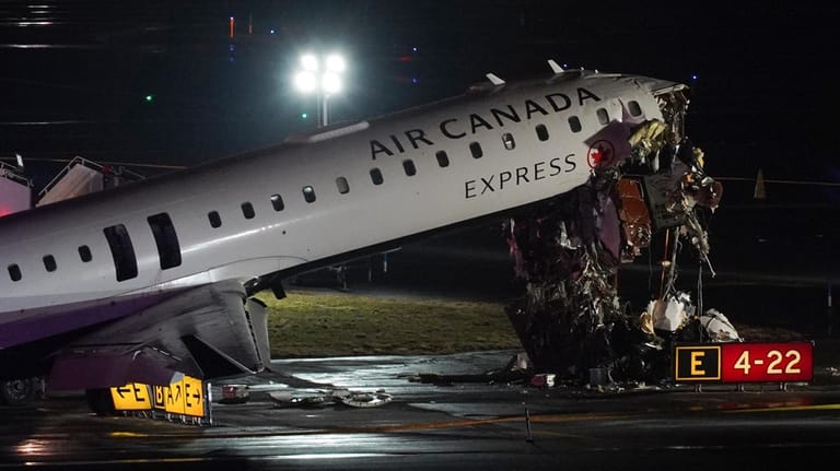 An Air Canada Jet sits on the runway at LaGuardia...