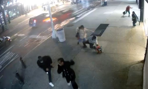 Pedestrians jump for cover as an out of control car speeds down 125th St. near Frederick Douglas Blvd. on Thursday night.
