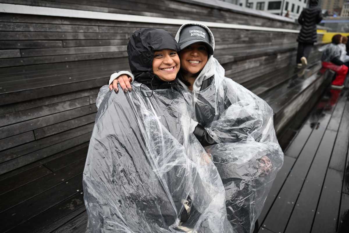 Fans waited in the rain at Pier 17 for a chance to hear BTS.