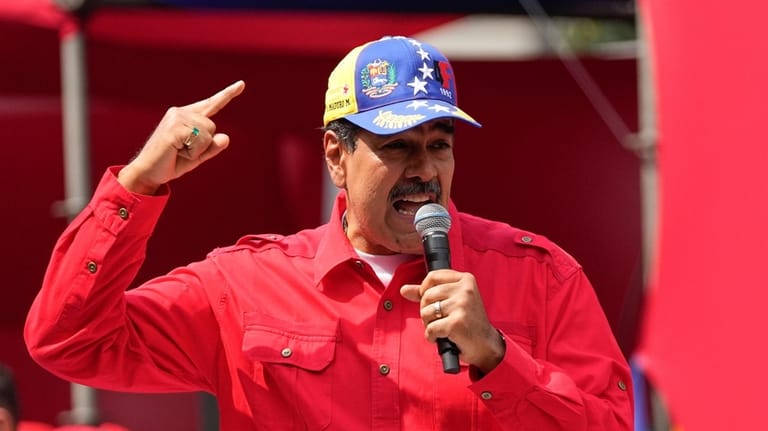 File - Venezuela's President Nicolas Maduro speaks to supporters during...