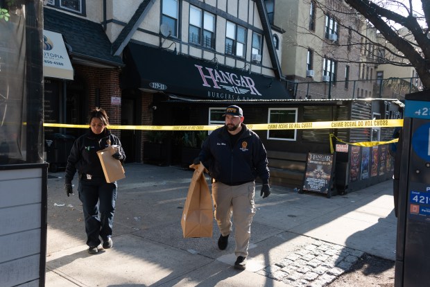 Police investigate a fatal shooting at 119-11 Metropolitan Ave. in Kew Gardens, Queens, on Tuesday, March 24, 2026. (Gardiner Anderson / New York Daily News)