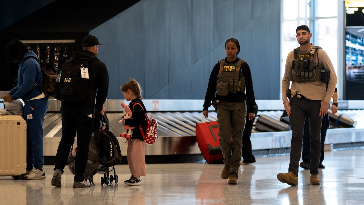 ice agents at baggage claim at newark airport in NJ