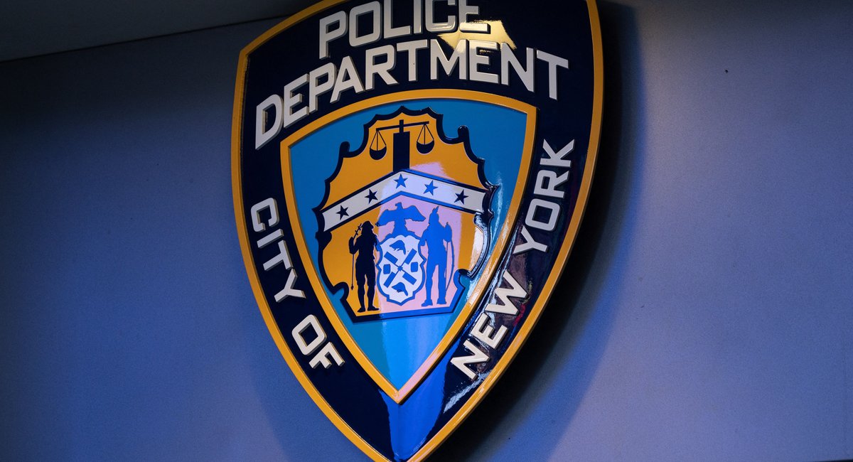 NYPD officer pulls gun on civilian colleague, charged with menacing, police say