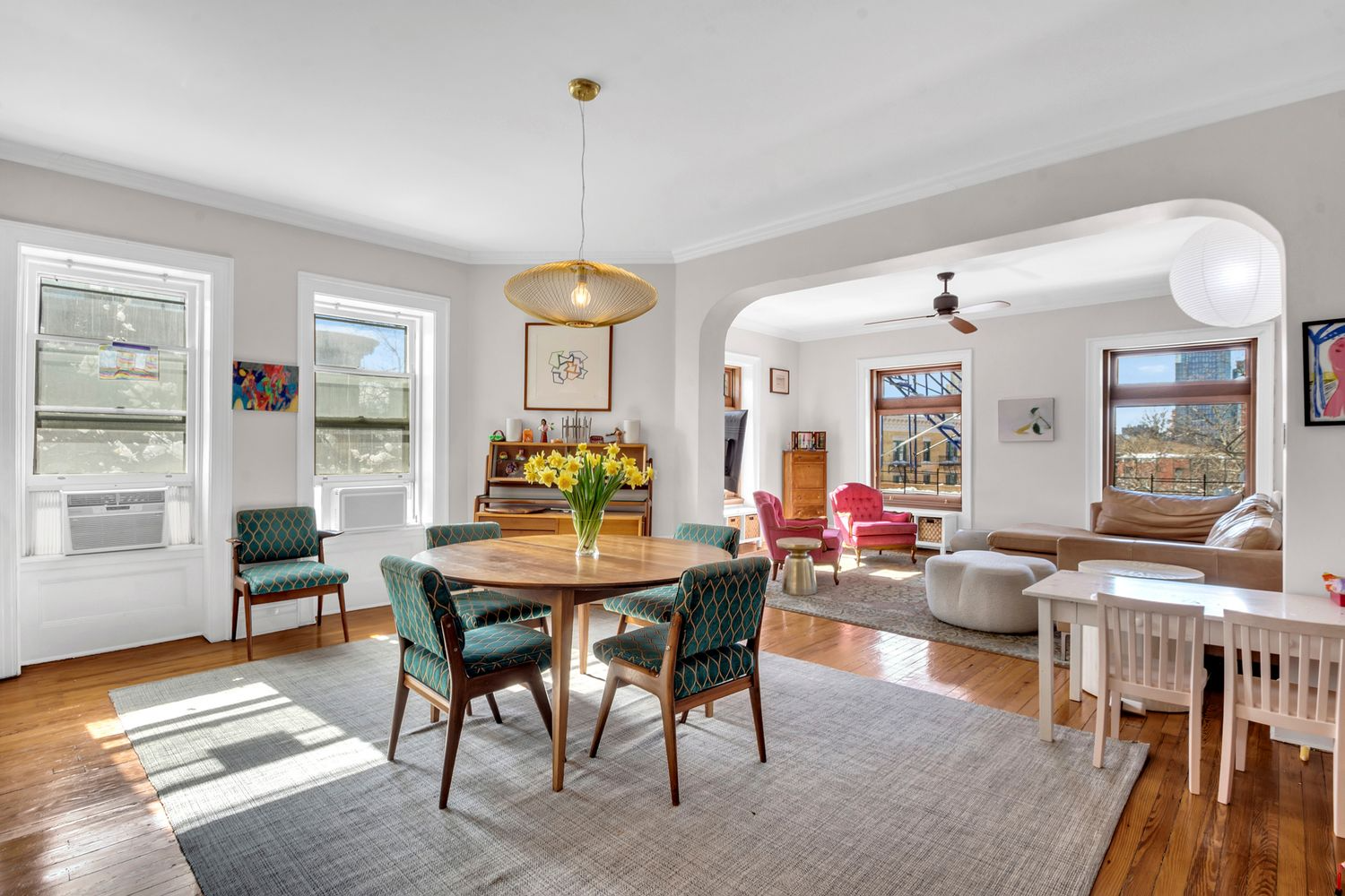 clinton hill apartment with dining room and arched doorway to living room