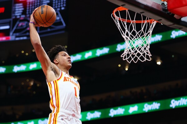 Atlanta Hawks forward Jalen Johnson gets ready to dunk during the first half of an NBA basketball game against the Brooklyn Nets, Thursday, March 12, 2026, in Atlanta. (AP Photo/Colin Hubbard)