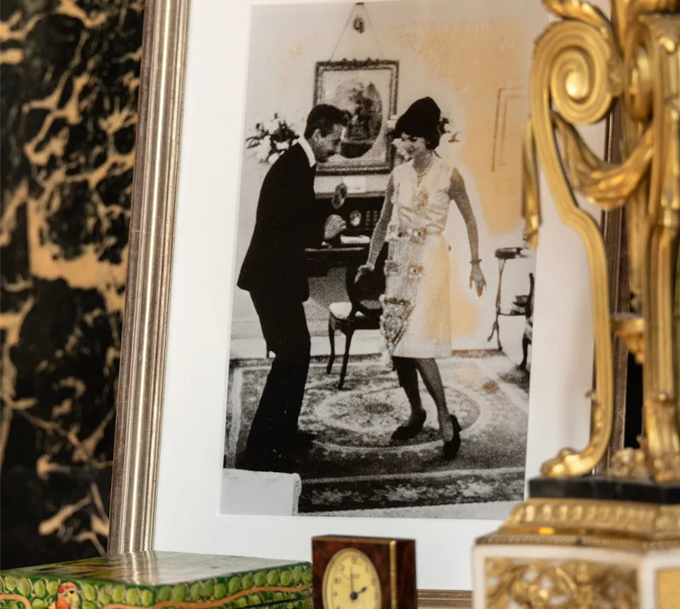 A fireplace mantle featured a photo of fashion designer Oleg Cassini with longtime client Jacqueline Kennedy from back in her days as First Lady.