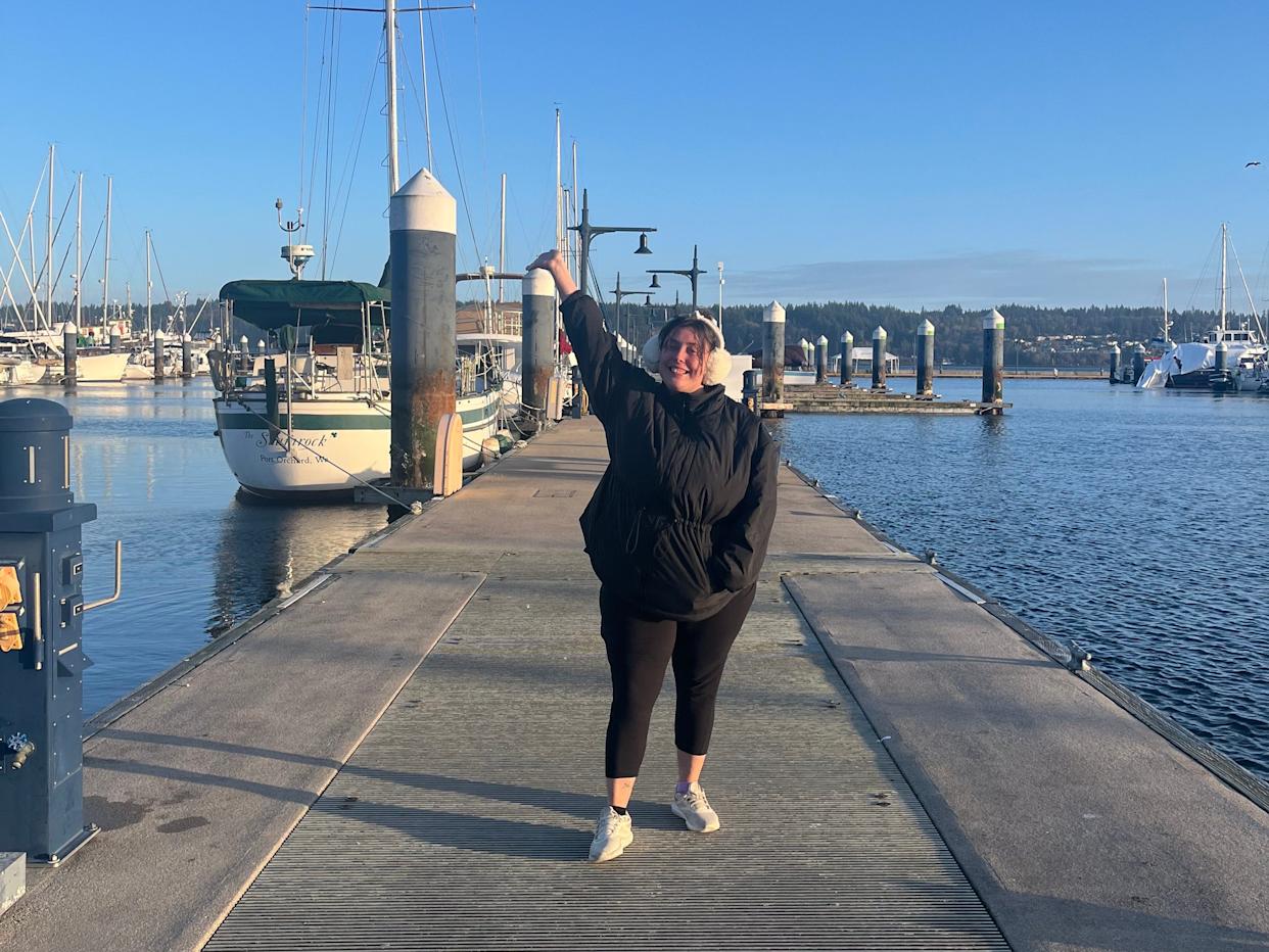Emma Kershaw on a pier with blue skies above