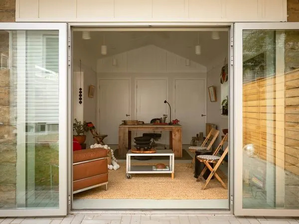Cunningham’s clients sought a true indoor/outdoor space so he installed two sets of glass doors from Gamco that the family can swing wide open.