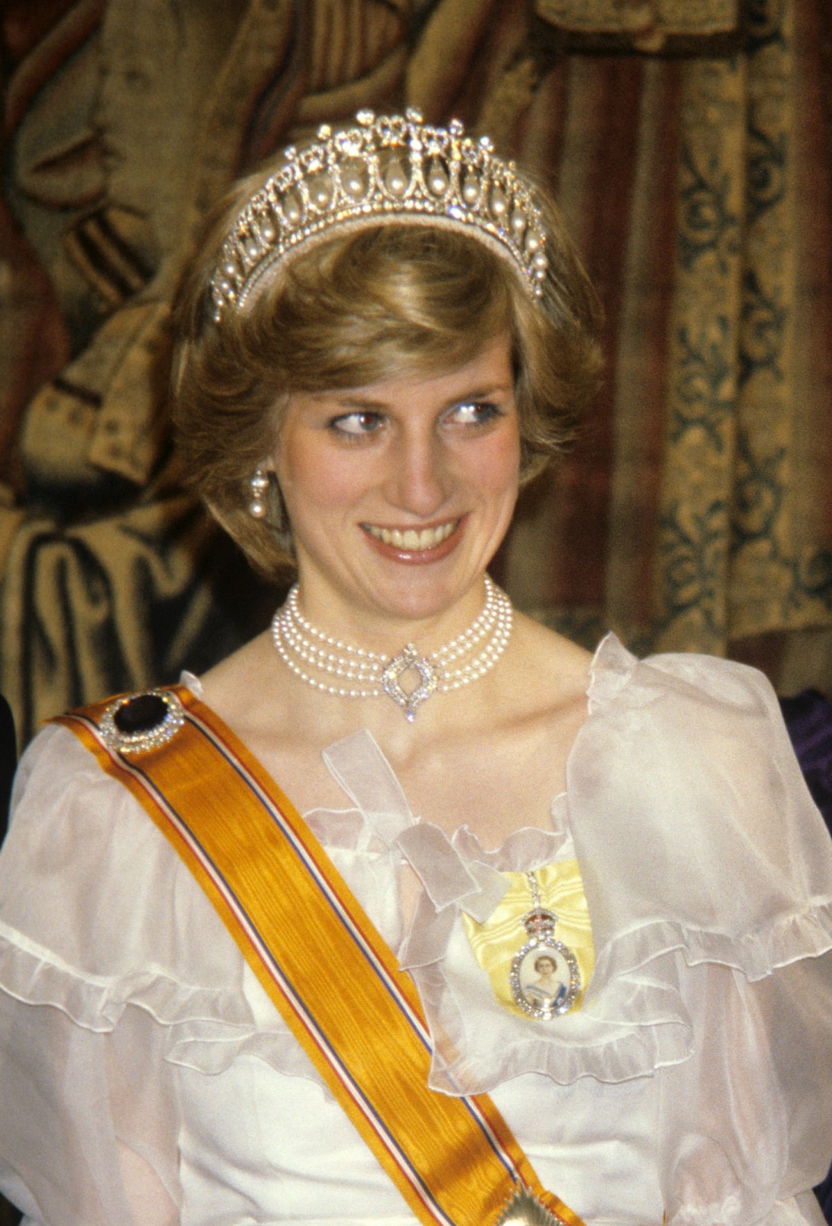 The Princess of Wales attends a return banquet at Hampton Court Palace given by Queen Beatrix of the Netherlands on November 17, 1982 (PA Images/Alamy)