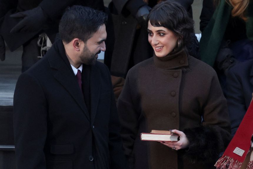 New York City Mayor Zohran Mamdani's wife, Rama Duwaji, looks at him as they take part in his inauguration ceremony on January 1, 2026.