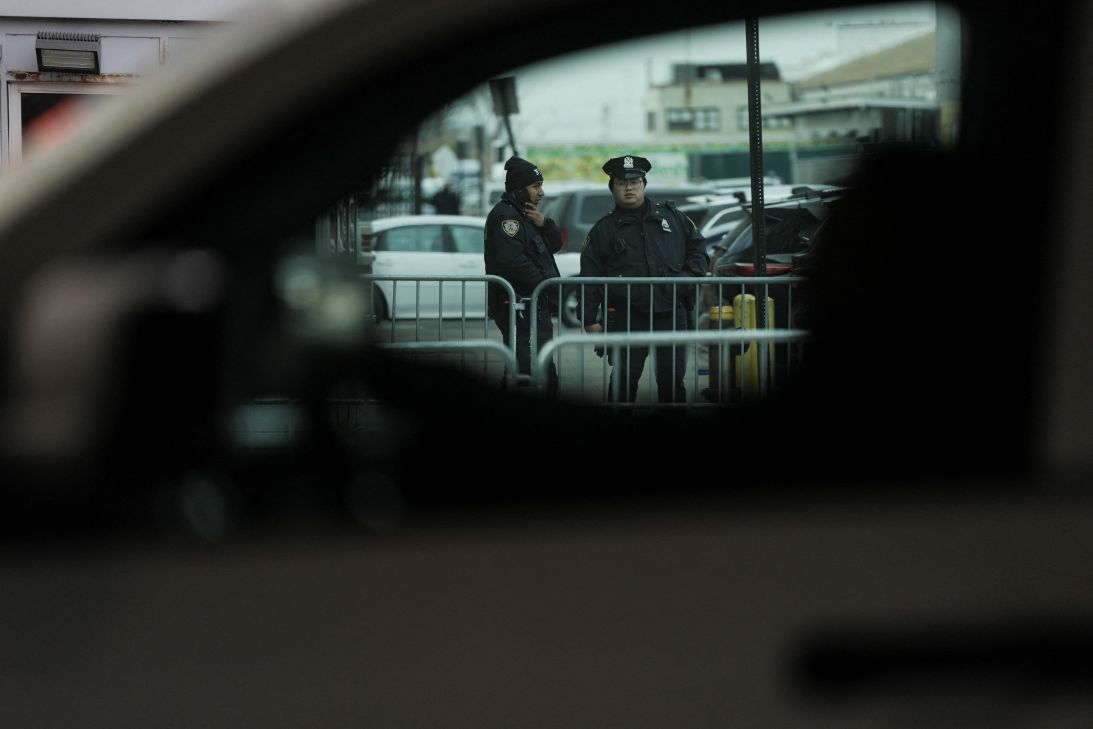 Police officers are pictured through a car window as they work outside the Metropolitan Detention Center in Brooklyn (MDC Brooklyn), where captured Venezuelan President Nicolas Maduro is held, seen on January 5, 2026.