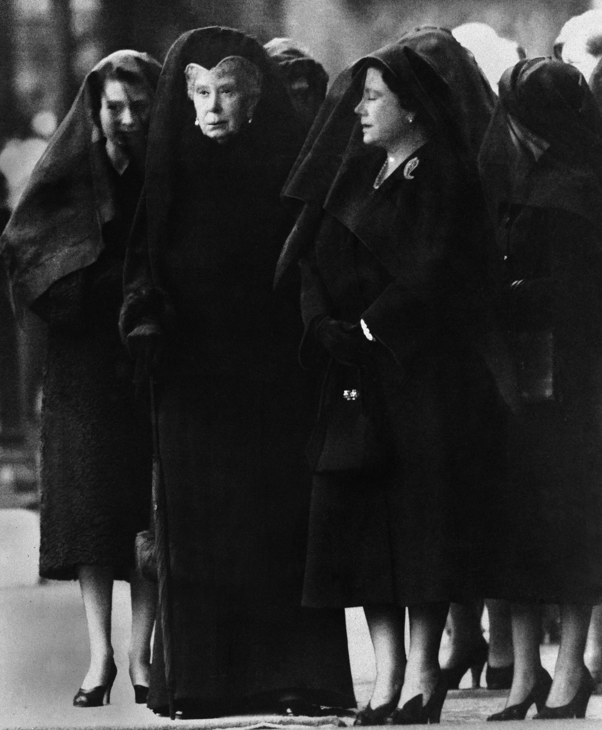 Ronald Case's famous "Three Queens in Mourning" photograph, showing Queen Elizabeth II, Queen Mary, and Queen Elizabeth the Queen Mother outside Westminster Hall in London ahead of the arrival of the body of King George VI on February 11, 1952 (Mirrorpix/Alamy)