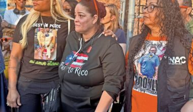 During the rally, Alexandra Diaz, left, who lost her son to gun violence last year embraced Carmen Ramos, center, whose brother was also fatally shot in 2025. Marisol Miranda, right, whose son was stabbed to death by a teen last year, stood beside them.