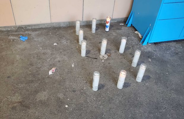 A candle memorial for Kamadre Coleman, 16, is pictured Tuesday, March 24, 2026, outside the Sheepshead Bay Houses on Avenue X in Brooklyn, where Coleman was fatally shot a day earlier.