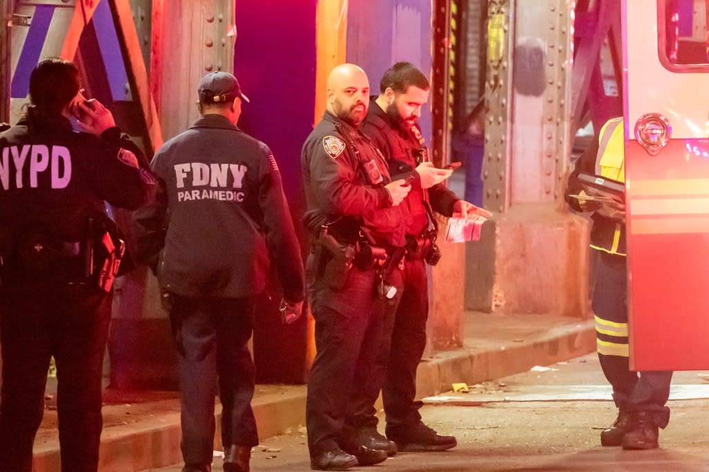 NYPD and EMTs at the scene of a fatal car accident involving a garbage truck and a pedestrian on Roosevelt Ave near 63rd St n the Woodside neighborhood of Queens. William Miller