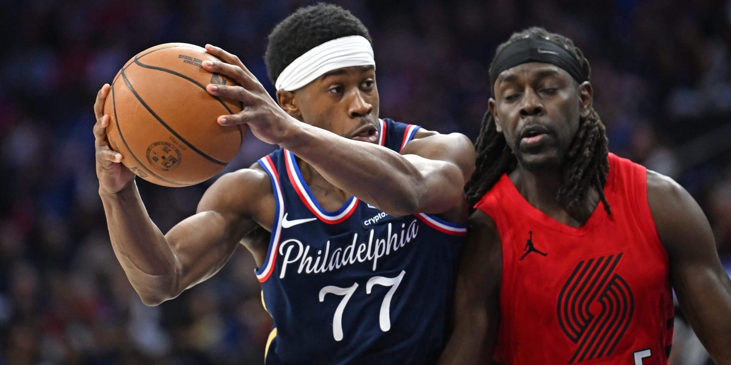 Sixers rookie VJ Edgecombe drives against Portland's Jrue Holiday.