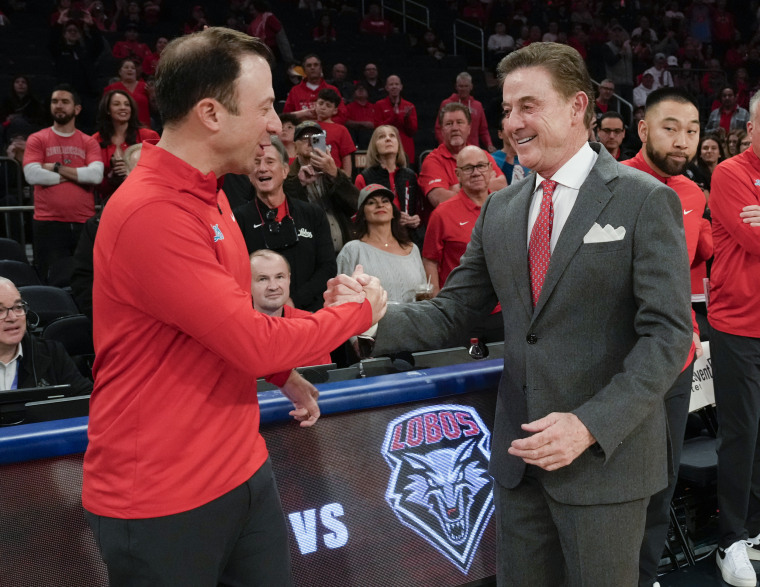 St. John's head coach Rick Pitino, right, greets his son, former New Mexico head coach Richard Pitino, before a college basketball game at Madison Square Garden on Nov. 17, 2024.