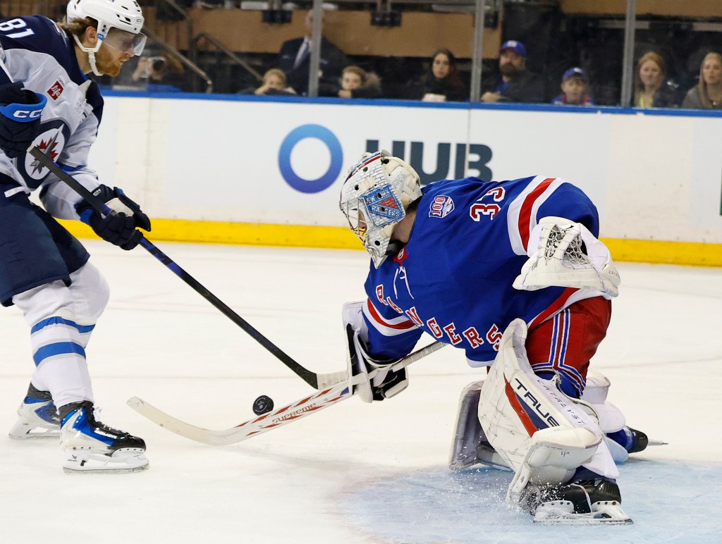 Goaltender Dylan Garand #33 of the New York Rangers defends the net during the second period against the Jets on March 22, 2026.