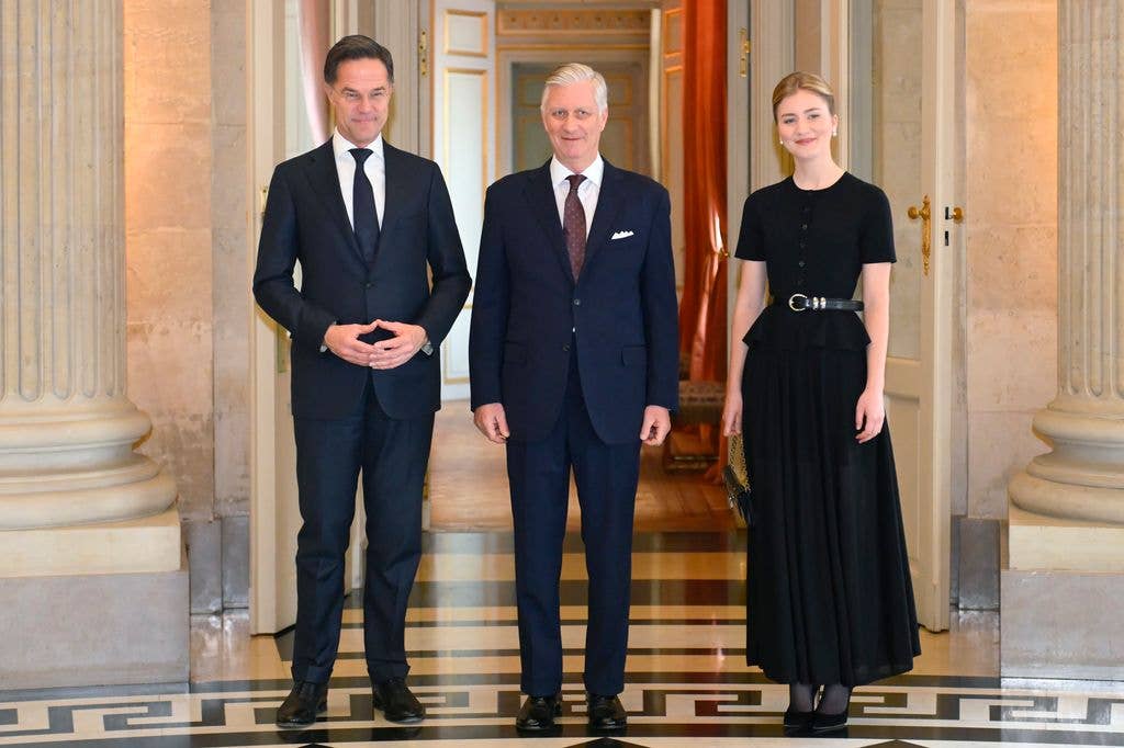 Princess Elisabeth in black dress beside King Philippe and NATO Secretary General Mark Rutte
