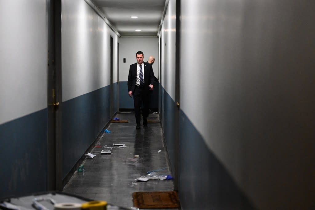 An NYPD detective walks outside the scene of a fatal stabbing at Ebbets Field Apartments in Brooklyn on Saturday. Kyle Mazza
