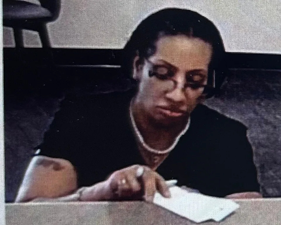 This bank security video shows a woman the Flagler County Sheriff's Office identified as Nzinga Parcella Walker, who has been accused of making fraudulent transactions.