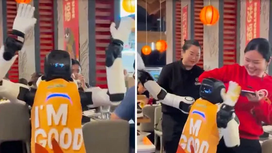 A dancing robot with employees.