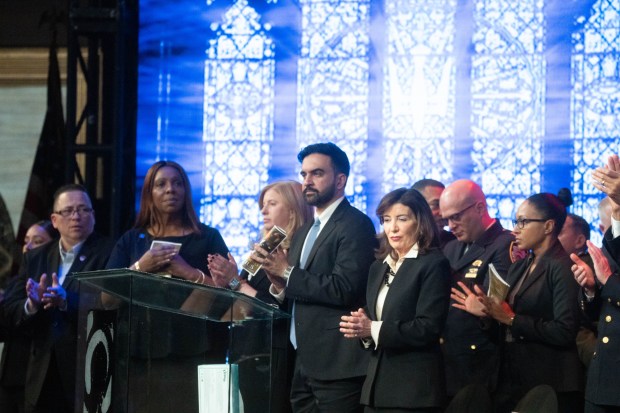 New York City Mayor Zohran Mamdani, Gov. Kathy Hochul and New York AG Letitia James attend the funeral of Police Officer and U.S. Army National Guard Major Sorffly Daviuswho died March 6, 2026, while serving with the 42nd Infantry Division at Camp Buehring, Kuwait, at the Christian Cultural Center in Brooklyn on Friday, March 26, 2026. 