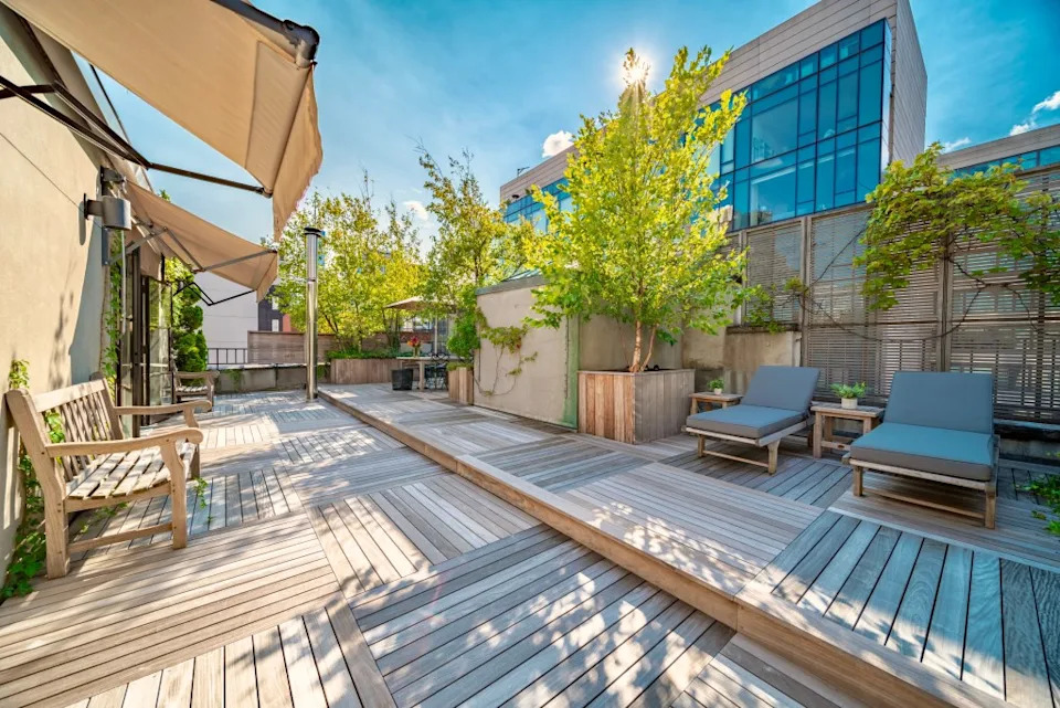 The outdoor space offers tons of room for warm-weather lounging. The Cote Team