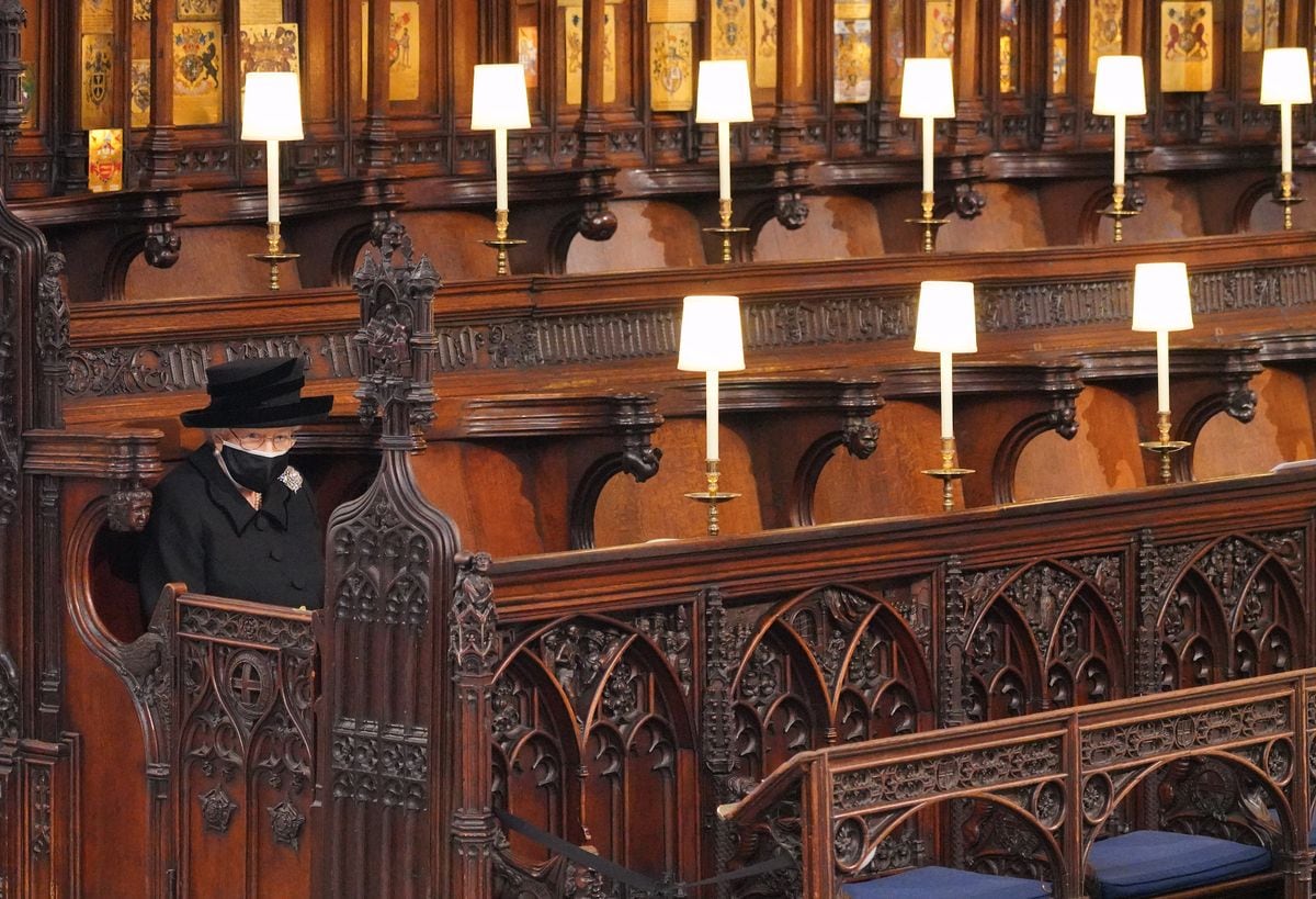 Queen Elizabeth II sitting alone at Prince Philip funeral Windsor Castle