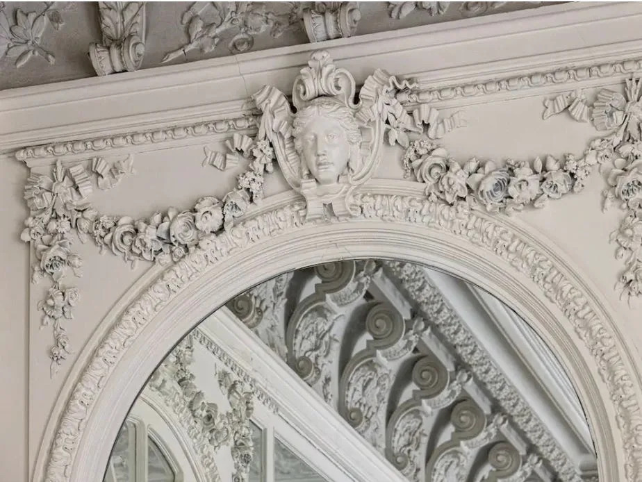 Garlands of plasterwork roses ring the second floor's sunny drawing room.