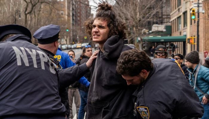 Counter-protester Emir Balat is detained by New York Police Department (NYPD) officers outside Gracie Mansion, the official residence of New York Mayor Zohran Mamdani, during an anti-Islam protest led by far-right activist Jake Lang in New York City, New York, US, March 7, 2026. — Reuters