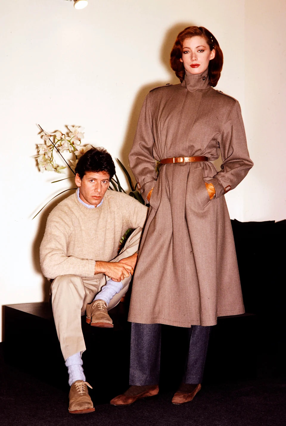 Designer Calvin Klein presents a look from his Fall 1980 Ready to Wear collection, in New York City. The model wears a tan worsted wool high-necked coat from the collection.