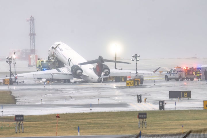 An Air Canada Express CRJ-900 sits on the runway at LaGuardia Airport on March 23, 2026. The pilot and co-pilot of the Air Canada jetliner were pronounced dead after their aircraft collided with a Port Authority truck on the runway in Queens, New York City on Sunday, March 22, 2026.