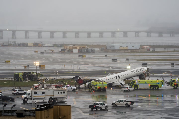 An Air Canada jet and Port Authority fire truck sit on the runway at LaGuardia Airport, Monday, March 23, 2026, after colliding with each other after the Jet landed Sunday night in New York.