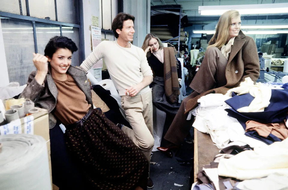 Designer Calvin Klein, along with models Janice Dickinson, Iman, and Beverly Johnson, prepares for his Fall 1977 Ready to Wear Runway show at 205 West 39th Street in New York City.