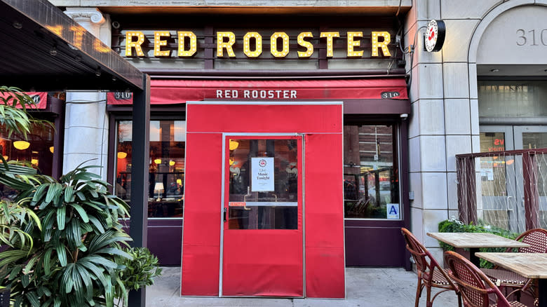 Outside red front doors of Red Rooster in Harlem, NYC