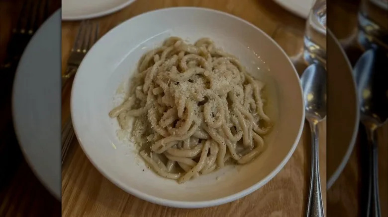 Pasta is served in a bowl.