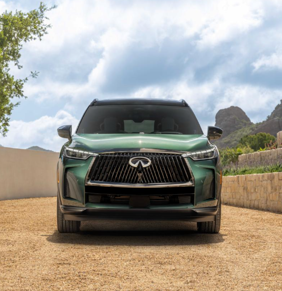 person in a car interior highlighting a water bottle and an award