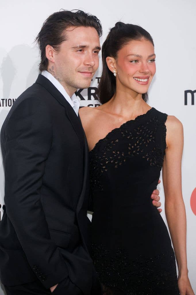 brooklyn Peltz Beckham and Nicola Peltz Beckham smiling in black outfits