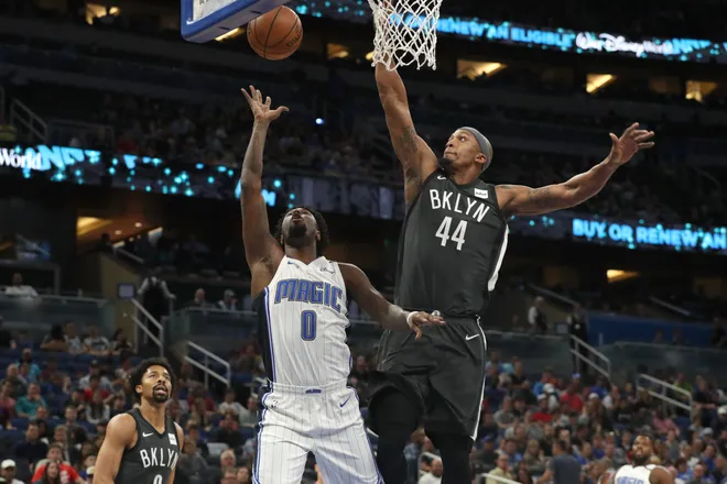 Mar 28, 2018; Orlando, FL, USA; Brooklyn Nets forward Dante Cunningham (44) blocks Orlando Magic guard Jamel Artis (0) shot during the first quarter at Amway Center. Mandatory Credit: Kim Klement-USA TODAY Sports