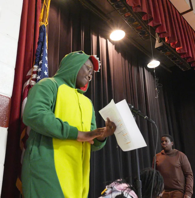 Eighth-graders Cleavens Blanc as a dinosaur and Julian Joissaint in Mr Brown Can Moo! Can you? during a staged reading of Dr. Seuss books at St Anthony's School in Nanuet March 5, 2026.