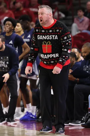 Queens Royals head coach Grant Leonard during the second half against the Arkansas Razorbacks at Bud Walton Arena.